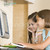 Two young girls in kitchen with computer smiling stock photo © monkey_business