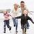 Family running on beach holding hands smiling stock photo © monkey_business