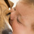 Baby kissing dog stock photo © monkey_business