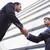 Businessmen shaking hands outside office building stock photo © monkey_business