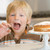 Young boy in kitchen with cake on counter stock photo © monkey_business