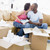 Couple unpacking boxes in new home kissing and smiling stock photo © monkey_business
