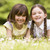 zwei · Schwestern · Freien · lächelnd · Blume · Kinder - stock foto © monkey_business