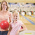 Woman and young girl in bowling alley holding ball and smiling stock photo © monkey_business
