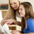Mother And Teenage Daughter At Home Using Computer stock photo © monkey_business