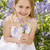 Young girl outdoors holding flowers smiling stock photo © monkey_business