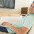 Man in living room using laptop smiling stock photo © monkey_business