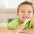 Young boy eating celery in living room smiling stock photo © monkey_business