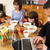 Family Using Gadgets Whilst Eating Breakfast Together In Kitchen stock photo © monkey_business