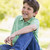 Young boy sitting outdoors smiling stock photo © monkey_business