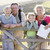 Family on cliffside path leaning on fence and smiling stock photo © monkey_business