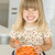 Young girl in kitchen eating carrot sticks smiling stock photo © monkey_business