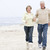 Couple at the beach holding hands and smiling stock photo © monkey_business