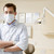 Dentist in exam room with mask on stock photo © monkey_business