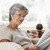 Woman in living room reading newspaper stock photo © monkey_business