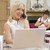 Woman in home office with laptop and telephone with mother and b stock photo © monkey_business