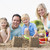 Family on beach making sand castles smiling stock photo © monkey_business