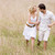 Couple walking outdoors holding hands smiling stock photo © monkey_business