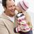 Father holding daughter kissing him at beach smiling stock photo © monkey_business