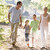 Family running outdoors holding hands and smiling stock photo © monkey_business