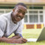 College student using laptop on campus lawn stock photo © monkey_business