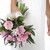 menyasszony · tart · virágcsokor · rózsaszín · virágok · nő - stock fotó © monkey_business