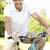 fiatalember · lovaglás · bicikli · vidék · mosoly · portré - stock fotó © monkey_business