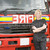 Portrait of a firefighter standing by a fire engine stock photo © monkey_business
