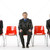 tre · uomini · d'affari · seduta · rosso · plastica · donna - foto d'archivio © monkey_business