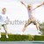 Two young girls jumping on trampoline smiling stock photo © monkey_business