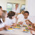 Schoolchildren enjoying their lunch in a school cafeteria stock photo © monkey_business