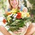 Woman with flowers smiling stock photo © monkey_business