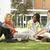 College students sitting and talking on campus lawn stock photo © monkey_business