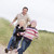 Father and two young children running at beach smiling stock photo © monkey_business
