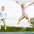 Two young boys jumping on trampoline smiling stock photo © monkey_business