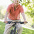 senior · homem · ciclo · exercer · bicicleta · sorridente - foto stock © monkey_business