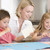 Woman and two young children in kitchen with art project smiling stock photo © monkey_business
