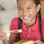 Young girl in dining room eating Chinese food smiling stock photo © monkey_business