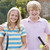 Young couple with rackets on tennis court smiling stock photo © monkey_business