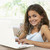 年輕的女孩 · 使用筆記本電腦 · 家 · 孩子 · 快樂 · 孩子 - 商業照片 © monkey_business