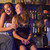 Two young women sitting on a bar counter, enjoying cocktails stock photo © monkey_business