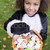 Young girl outdoors in cat costume on Halloween holding candy stock photo © monkey_business