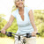 Portrait of mature woman riding cycle in countryside stock photo © monkey_business
