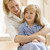 Woman in front hallway hugging young girl and smiling stock photo © monkey_business