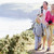 Family walking on cliffside path holding hands and smiling stock photo © monkey_business