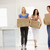 Three girl friends moving into new home smiling stock photo © monkey_business