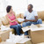 Couple unpacking boxes in new home smiling stock photo © monkey_business