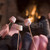 Feet warming at a fireplace with marshmallows on sticks stock photo © monkey_business