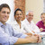 Four businesspeople in boardroom smiling stock photo © monkey_business