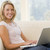 Woman in living room using laptop smiling stock photo © monkey_business